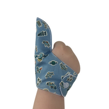 Load image into Gallery viewer, Treasures in the sky-themed thumb guard to help stop thumb sucking and other habits. A blue guard featuring a variety of things that are seen in the sky. The Thumb Guard Store.
