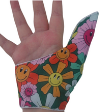 Load image into Gallery viewer, Thumb guard  to help stop thumb sucking habits.  Floral fabric. Image shows the palm side of the guard.
