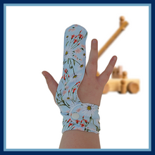 Load image into Gallery viewer, Finger guard for children who want to stop finger sucking.   Blue floral themed fabric
