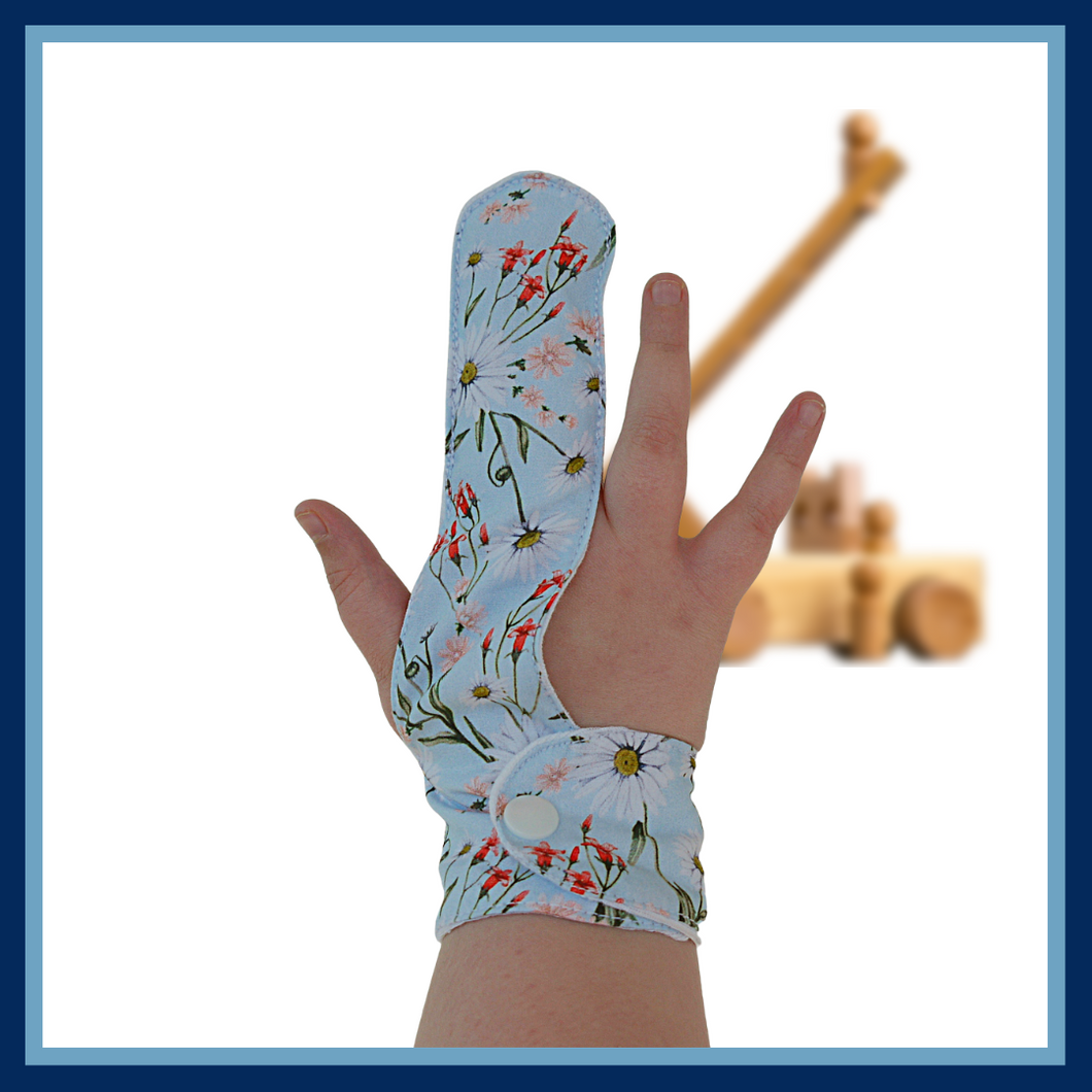 Finger guard for children who want to stop finger sucking.   Blue floral themed fabric