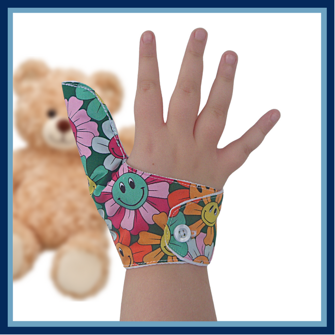 A fabric thumb guard made by The Thumb Guard Store, designed to help children and adults stop habits such as thumb sucking and skin picking. The guard in the image has a smiling flower-themed outer fabric and a moisture-resistant lining.