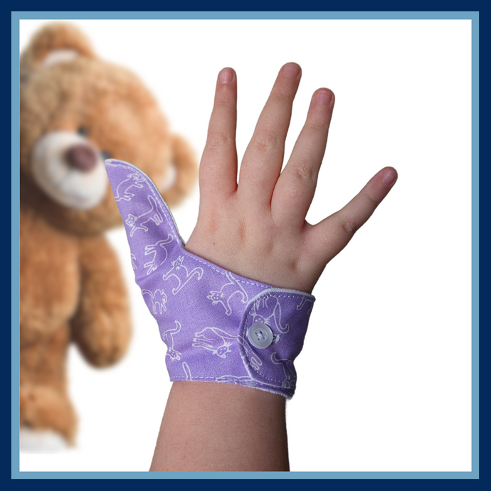 Purple coloured thumb guard with a cat design. Moisture resistant lining, to help stop thumb sucking. Made by The Thumb Guard Store.