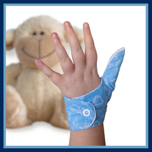 Load image into Gallery viewer, Blue coloured thumb guard with a dinosaur design. Moisture resistant lining, to help stop thumb sucking. Made by The Thumb Guard Store.
