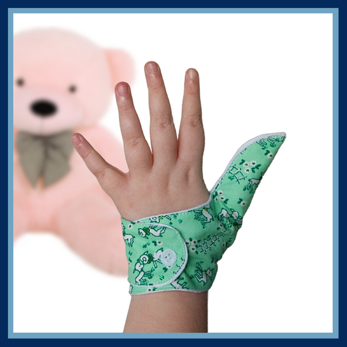 green coloured thumb guard with a lamb design. Moisture resistant lining, to help stop thumb sucking. Made by The Thumb Guard Store