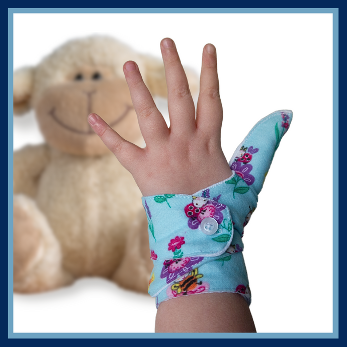 blue coloured cuffed thumb guard with a bugs and bees floral design. Moisture resistant lining, to help stop thumb sucking. Made by The Thumb Guard Store