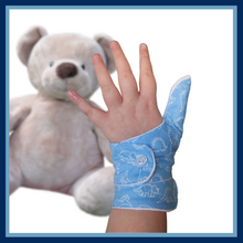 Load image into Gallery viewer, blue coloured cuffed thumb guard with a dinosaur design. Moisture resistant lining, to help stop thumb sucking. Made by The Thumb Guard Store.
