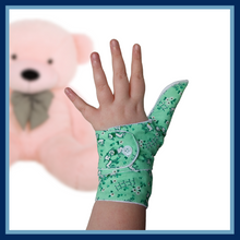 Load image into Gallery viewer, green coloured cuffed thumb guard with a lamb design. Moisture resistant lining, to help stop thumb sucking. Made by The Thumb Guard Store
