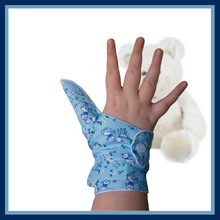 Load image into Gallery viewer, Double cuffed baby and toddler guard in a blue coloured fabric with a lamb design. Guard made by The Thumb Guard Store, to help babies and toddlers stop thumb sucking. Moisture resistant lining. Extra cuff helps prevent pulling off.
