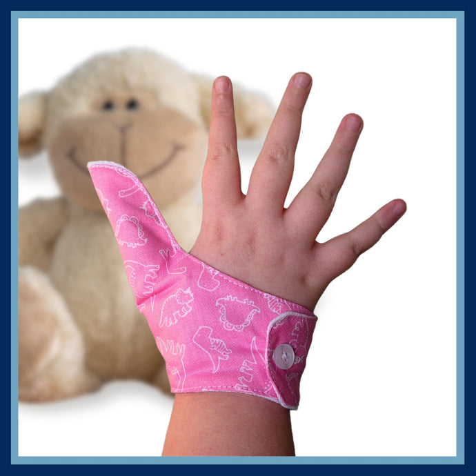 Pink coloured thumb guard with a dinosaur design. Moisture resistant lining, to help stop thumb sucking. Made by The Thumb Guard Store.