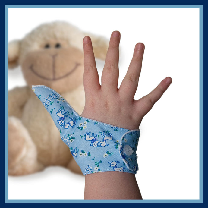Blue  coloured thumb guard with a lamb design. Moisture resistant lining, to help stop thumb sucking. Made by The Thumb Guard Store.
