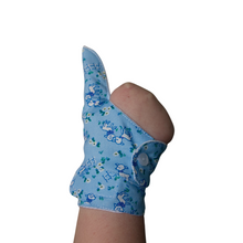 Load image into Gallery viewer, Double cuffed baby and toddler guard in a blue coloured fabric with a lamb design. Guard made by The Thumb Guard Store, to help babies and toddlers stop thumb sucking. Moisture resistant lining. Extra cuff helps prevent pulling off.
