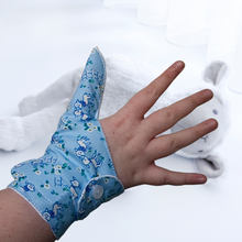 Load image into Gallery viewer, Double cuffed baby and toddler guard in a blue coloured fabric with a lamb design. Guard made by The Thumb Guard Store, to help babies and toddlers stop thumb sucking. Moisture resistant lining. Extra cuff helps prevent pulling off.
