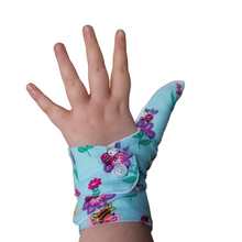 Load image into Gallery viewer, blue coloured cuffed thumb guard with a bugs and bees floral design. Moisture resistant lining, to help stop thumb sucking. Made by The Thumb Guard Store
