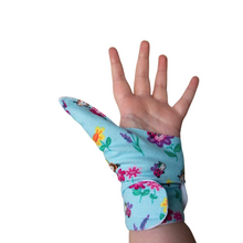 Load image into Gallery viewer, blue coloured cuffed thumb guard with a bugs and bees floral design. Moisture resistant lining, to help stop thumb sucking. Made by The Thumb Guard Store
