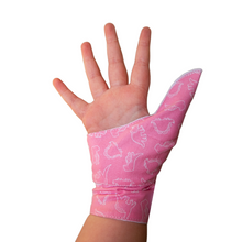 Load image into Gallery viewer, Pink coloured cuffed thumb guard with a dinosaur design. Moisture resistant lining, to help stop thumb sucking. Made by The Thumb Guard Store.
