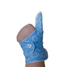 Load image into Gallery viewer, blue coloured cuffed thumb guard with a dinosaur design. Moisture resistant lining, to help stop thumb sucking. Made by The Thumb Guard Store.
