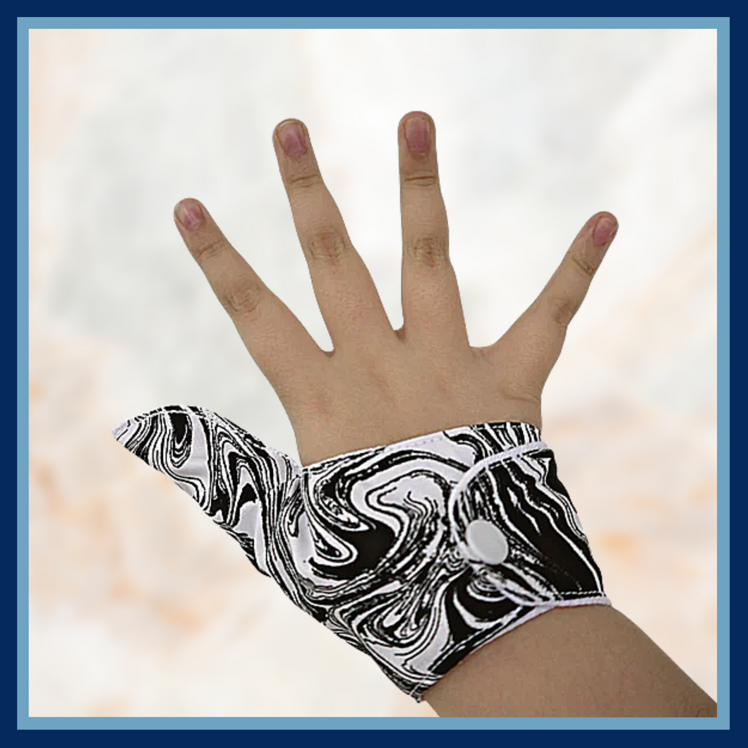 Adult size Thumb Guard. Stop thumb sucking or skin picking. Black and white patterned fabric