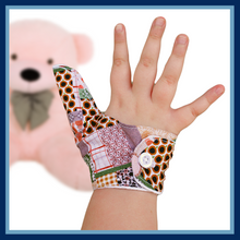 Load image into Gallery viewer, Thumb guard.  A patchwork themed thumb guard to stop thumb sucking habits.
