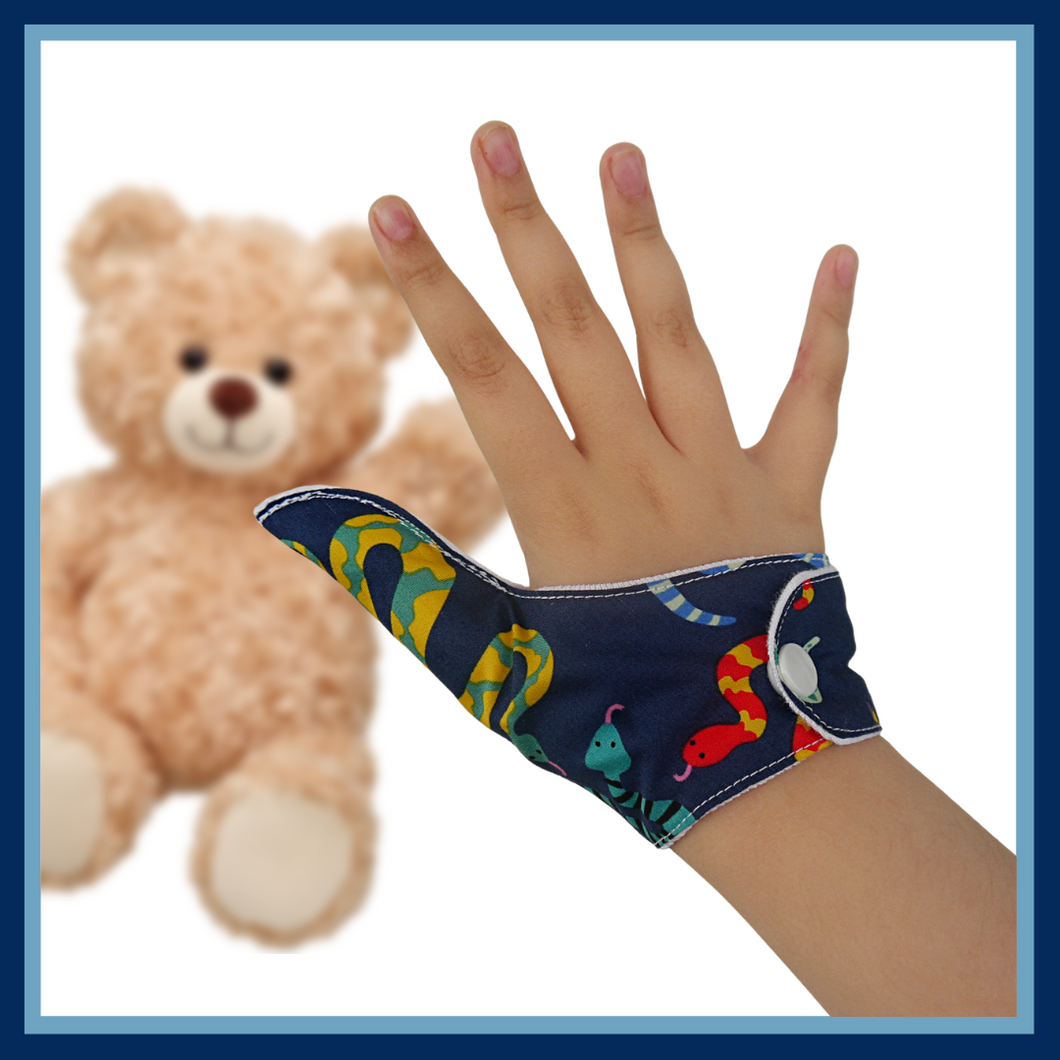 A fabric thumb guard to help stop thumb-sucking habits. The illustrated thumb guard has a colorful snake-themed outer fabric on a dark blue background. It has a moisture-resistant lining fabric and a snap fastening.  The Thumb Guard Store