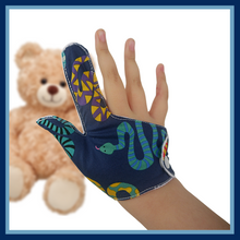 Load image into Gallery viewer, A fabric thumb and finger guard to help stop thumb-sucking habits. The illustrated thumb guard has a colorful snake-themed outer fabric on a dark blue background. It has a moisture-resistant lining fabric and a snap fastening.  The Thumb Guard Store

