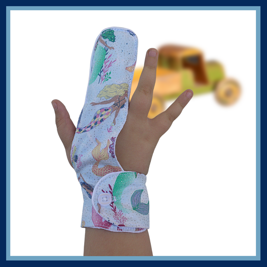A finger guard to help stop finger sucking habits. Fabric background is  light and glittery and features colourful mermaids. Has a moisture resistant lining . Made by the Thumb Guard Store