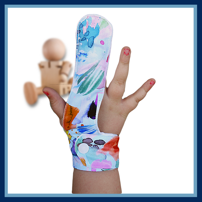 A water colour paint design finger guard to help stop habits like finger sucking. Has a moisture resistant lining.  The Thumb Guard Store