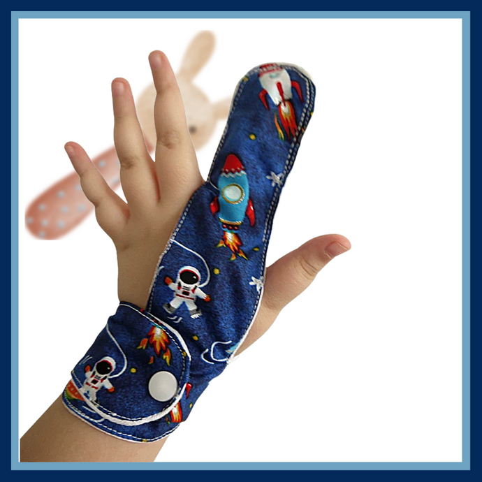 A finger guard to help children stop finger-sucking and other habits. Guard has a moisture-resistant lining. The outer fabric features a blue space travel design.  A choice of fastenings is available. The Thumb Guard Store