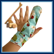 Load image into Gallery viewer,  A ladybird themed finger guard to help children stop finger sucking. Has a moisture resistant lining. The Thumb Guard Store
