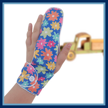 Load image into Gallery viewer, A finger guard to help stop finger sucking habits. Fabric background is blue and features colourful flowers. Has a moisture resistant lining . Made by the Thumb Guard Store
