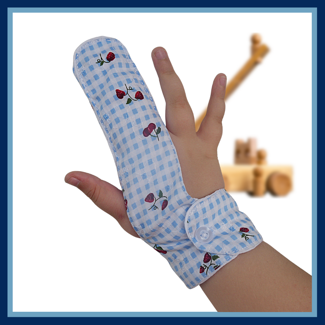 Finger guard is made from blue gingham fabric featuring strawberries and cherries, designed to help stop finger sucking, with a moisture-resistant lining and a choice of fastenings for comfortable and effective use. The Thumb Guard Store
