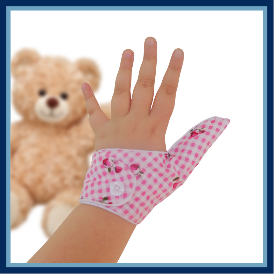 Prevent thumb sucking with this pink check, fruit themed, fabric thumb guard. Features strawberry and cherry design, moisture-resistant lining, and various fastening options. Say goodbye to the habit with comfort and style.