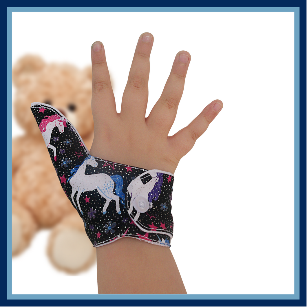 Unicorn-themed glittery fabric on a black background. Thumb Guard with moisture-resistant lining and various fastening options available. Made by The Thumb Guard Store to help stop finger-sucking and other habits.