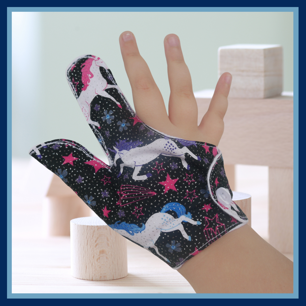 Unicorn-themed glittery fabric on a black background. Thumb Guard with moisture-resistant lining and various fastening options available. Made by The Thumb Guard Store to help stop finger-sucking and other habits. 