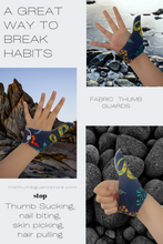 Load image into Gallery viewer, A fabric thumb guard to help stop thumb-sucking habits. The illustrated thumb guard has a colorful snake-themed outer fabric on a dark blue background. It has a moisture-resistant lining fabric and a snap fastening.  The Thumb Guard Store
