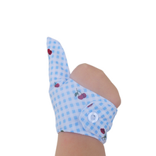 Load image into Gallery viewer, Prevent thumb sucking with this blue check, fruit themed, fabric thumb guard. Features strawberry and cherry design, moisture-resistant lining, and various fastening options. Say goodbye to the habit with comfort and style.
