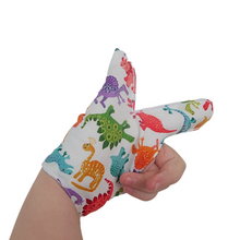 Load image into Gallery viewer, Fabric thumb and finger guard by the Thumb Guard Store, made with top-quality fabrics, and a moisture-resistant lining,  three fastening options. Colourful dinosaur themed. They&#39;re easy to wash and fast drying for convenience and longevity.
