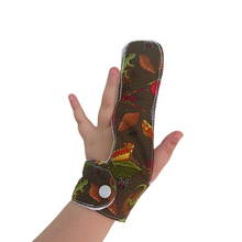 Load image into Gallery viewer, Finger guards from the Thumb Guard Store with moisture-resistant lining and three fastening options. Made with quality brown fabric featuring creatures from the forest floor, they are easy to wash by hand and fast drying for ultimate convenience.
