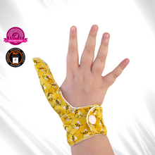 Load image into Gallery viewer, A bee themed thumb guard to help children and adults stop thumb sucking, skin picking and hair pulling habits. The guard features glittery bees on a yellow background. It has a moisture resistant lining
