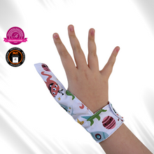 Load image into Gallery viewer, An alien themed thumb guard to help children and adults stop thumb sucking, skin picking and hair pulling  habits. The guard features cartoon style aliens on a white background. It has a moisture resistant lining
